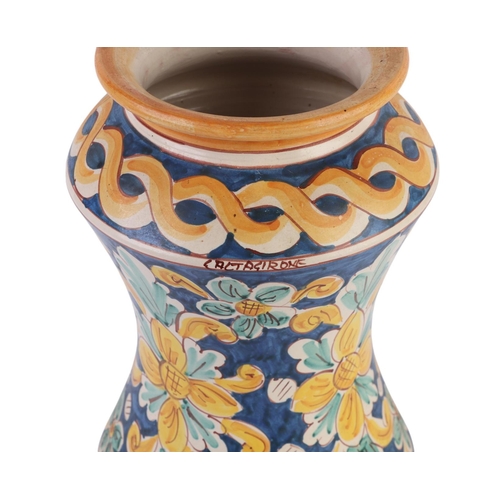 416 - A continental faience wine or water carrier; together with an arbarello of waisted form, decorated w... 