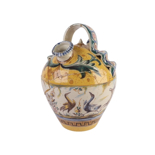 416 - A continental faience wine or water carrier; together with an arbarello of waisted form, decorated w... 