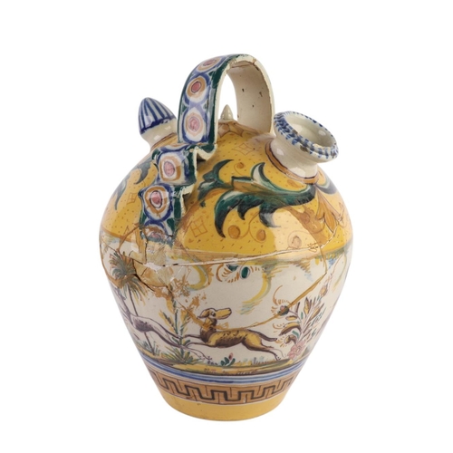 416 - A continental faience wine or water carrier; together with an arbarello of waisted form, decorated w... 