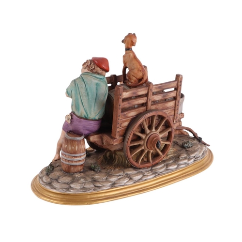 428 - A Capo di Monti figural group depicting two boys and a dog fixing the wheel on a barrel cart, 35cms ... 