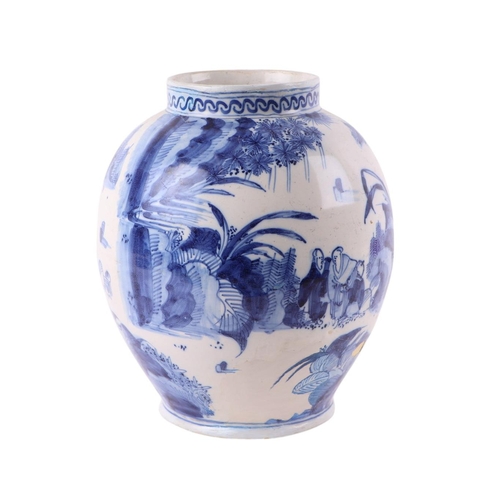 440 - An 18th century Delft blue & white baluster vase decorated in the chinoiserie style with figures in ... 