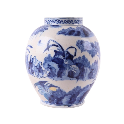 440 - An 18th century Delft blue & white baluster vase decorated in the chinoiserie style with figures in ... 