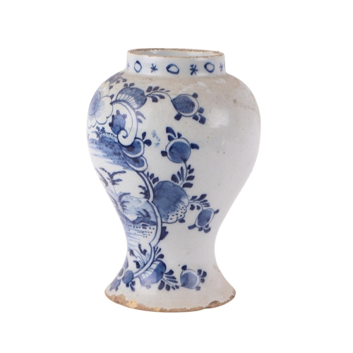 441 - An 18th century blue & white Delft vase decorated in the chinoiserie style with buildings in a lands... 