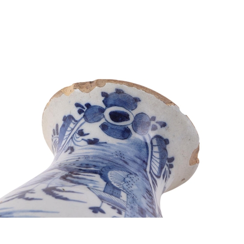 441 - An 18th century blue & white Delft vase decorated in the chinoiserie style with buildings in a lands... 