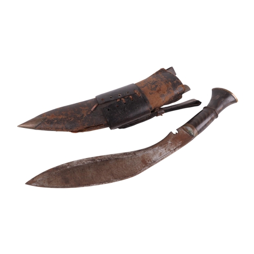 45 - A kukri and scabbard, 43cms long; together with a Middle Eastern dagger in a leather scabbard, 37cms... 