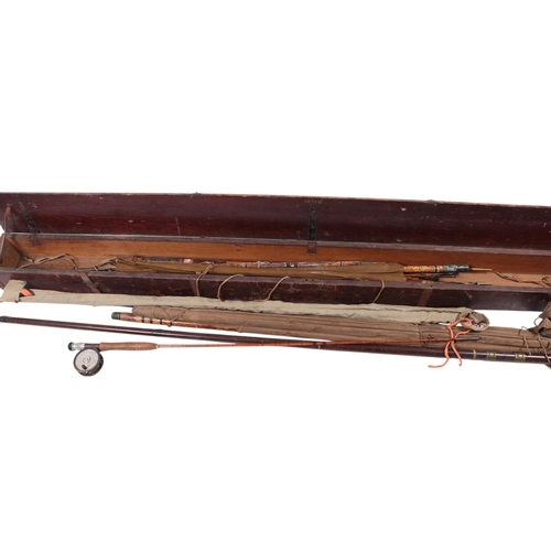 455 - Fishing interest.  A 19th century stained pine fishing rod case containing an assortment of split ca... 