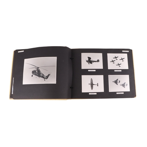 46 - A mid 20th century photograph album containing black & white photos of planes, helicopters and ships... 