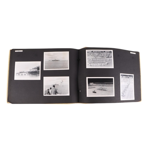 46 - A mid 20th century photograph album containing black & white photos of planes, helicopters and ships... 