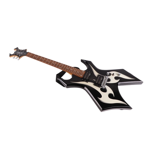 483 - A B C Rich bronze series Warlock six-string electric guitar in a soft carry case, 112cms long.