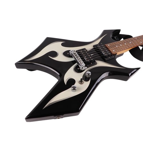 483 - A B C Rich bronze series Warlock six-string electric guitar in a soft carry case, 112cms long.