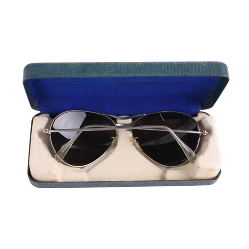 50 - A cased set of Mk14 22C/2432 sunglasses; together with a pair of leather trimmed goggles and a Luftw... 