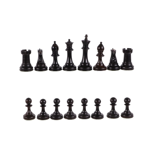 510 - A boxwood and ebonised chess set in a mahogany box, king height 6.5cms high; together with a boxed g... 