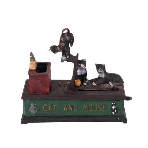 520 - A cast iron cat-and-mouse money bank, 20cms long.