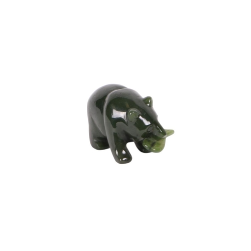 521 - A Canadian jade figure in the form of a bear holding a salmon in its mouth, 2cms long.