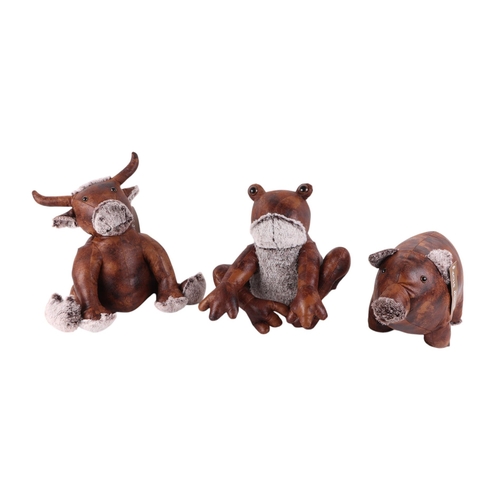 522 - A group of modern doorstops to include a leather pig, cow and frog; and a tartan teddy bear and dog.