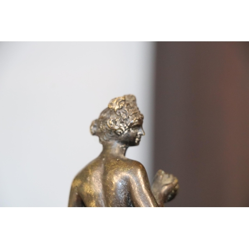 523 - A 19th century continental bronze figure of a woman holding fruit, possibly Eve, standing on a hexag... 