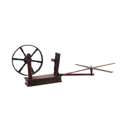 525 - A late 18th / early 19th table top treen lace makers wool winder with wheel and swing arm above a si... 