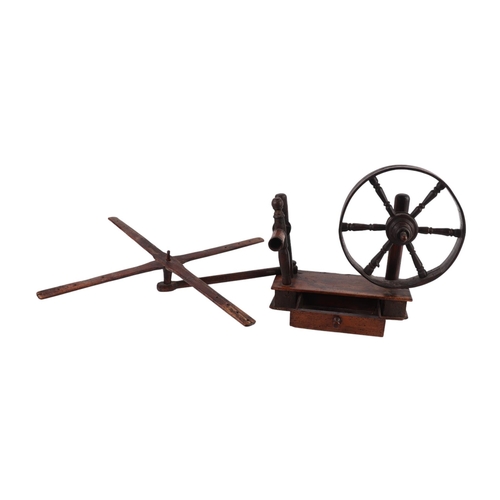 525 - A late 18th / early 19th table top treen lace makers wool winder with wheel and swing arm above a si... 