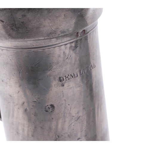 533 - An early 19th century French demi-litre lidded pewter measure, stamped 'Lille' with crown & rose mar... 