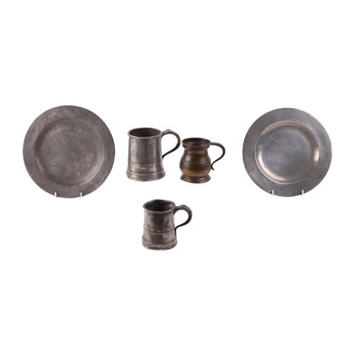 534 - A Georgian pewter pint tankard; together with two Victorian half pint measures and two 18th century ... 