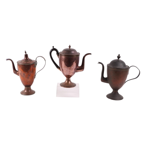 538 - An early 19th century French copper coffee pot; together with two other similar coffee pots(one with... 