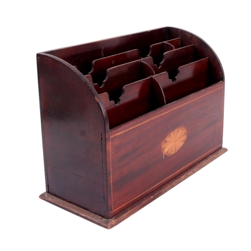 553 - An Edwardian inlaid mahogany desk top letter rack, 30cms wide.