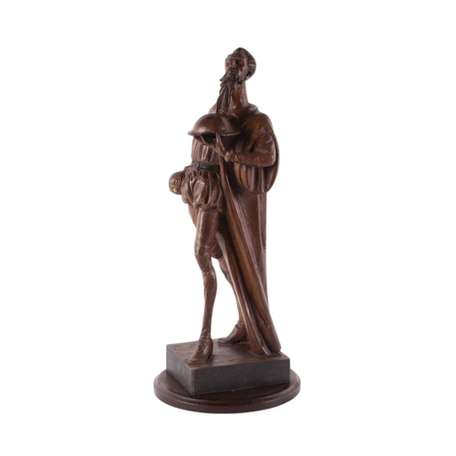 561 - A carved wooden sculpture depicting Don Quixote standing on a plinth, approx 39cms high.Condition Re... 