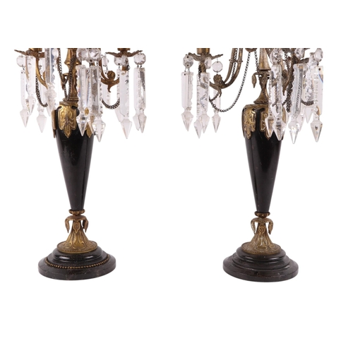 568 - A pair of marble & gilt three-branch candelabra with cut glass lustre drops, 53cms high (2).