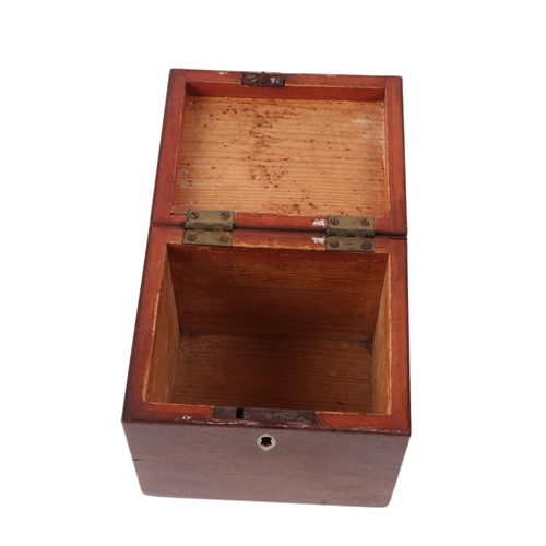 604 - A Georgian mahogany tea caddy, 11cms wide, 10.5cms high and 9cms deep.