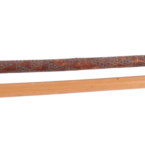 606 - A silver mounted Malacca walking cane, London 1925. 92cm long together with a chip carved walking st... 