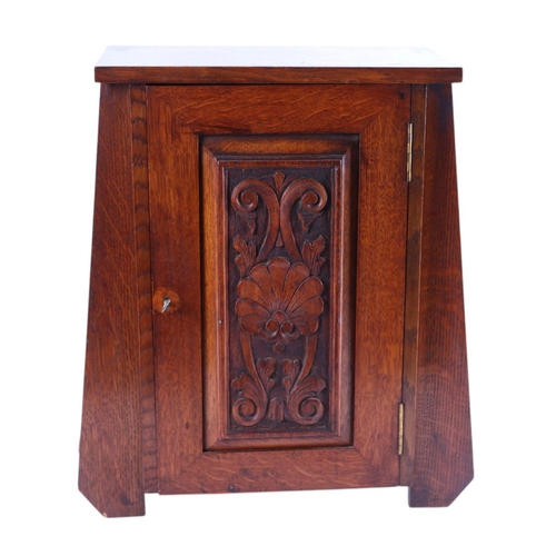 614 - A quantity of smoking related items to include an Art Nouveau oak smoker's cabinet with carved panel... 