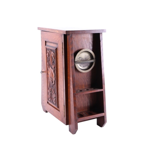 614 - A quantity of smoking related items to include an Art Nouveau oak smoker's cabinet with carved panel... 