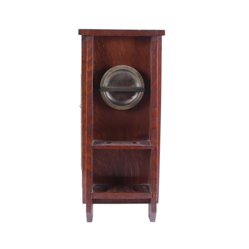 614 - A quantity of smoking related items to include an Art Nouveau oak smoker's cabinet with carved panel... 