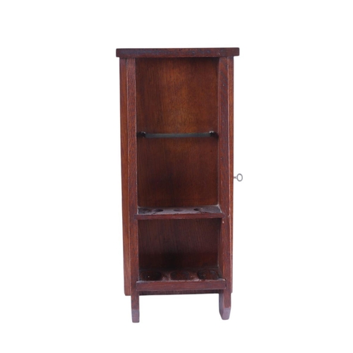 614 - A quantity of smoking related items to include an Art Nouveau oak smoker's cabinet with carved panel... 