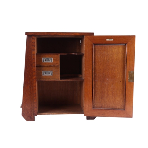 614 - A quantity of smoking related items to include an Art Nouveau oak smoker's cabinet with carved panel... 