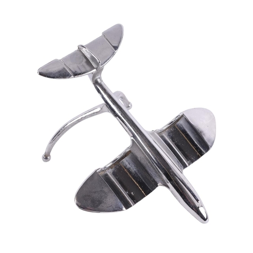 615 - An Art Deco novelty cruet set in the form of a chrome plated aeroplane with the pepper and pepperett... 