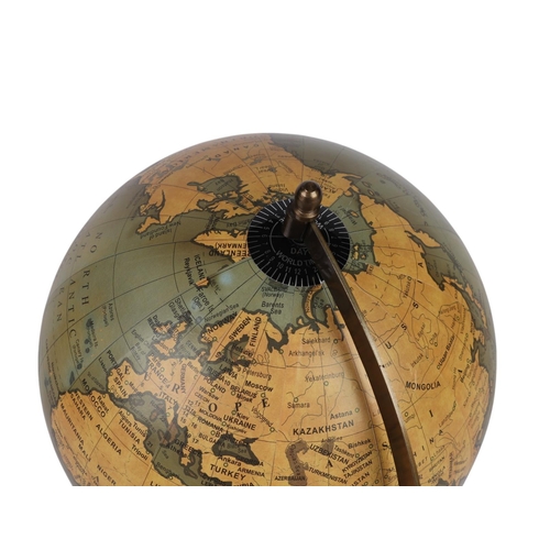 616 - A world globe on an ebonised stand. 35cm high