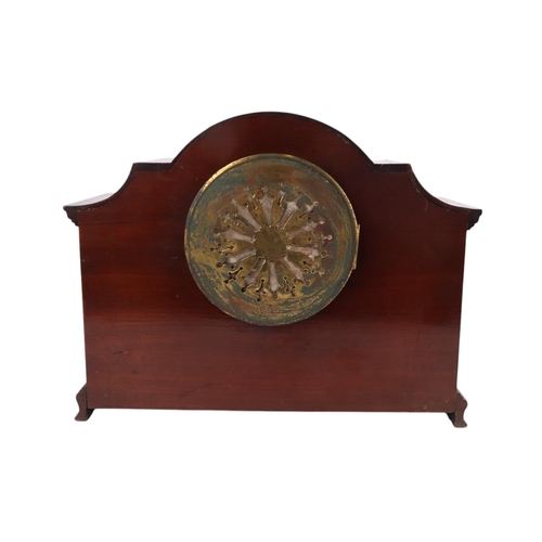 628 - An Edwardian inlaid mahogany cased mantle clock, the silver dial with Roman numerals, 32cms wide.Con... 