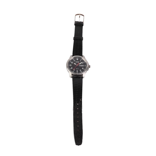 635 - A gentleman's Citizen Eco-Drive WR100 wristwatch with black face and day / date aperture.