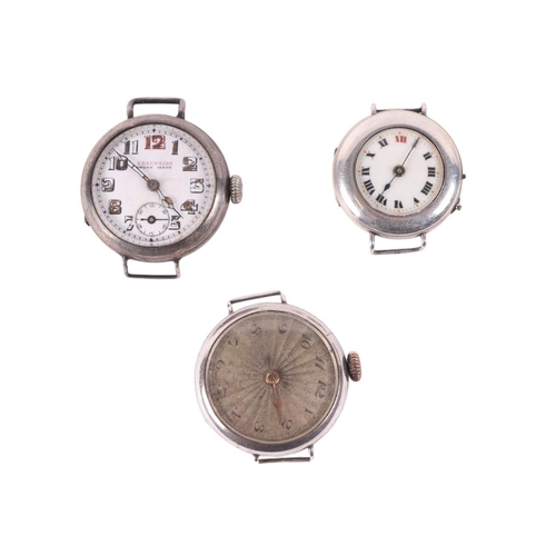 652 - A group of three silver cased trench watches.