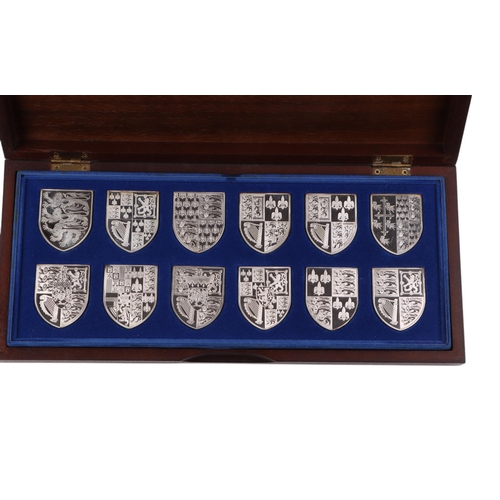 657 - Silver Royal Coat of Arms ingots by Danbury Mint, approx 524g.