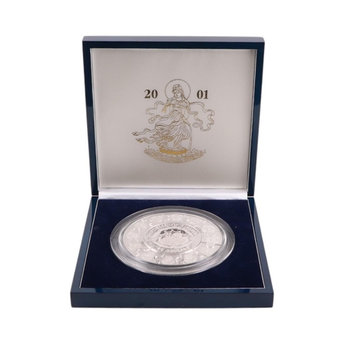 691 - A 2001 Republic of Liberia Lady Kuan Yin 1kg silver puzzle coin, boxed.