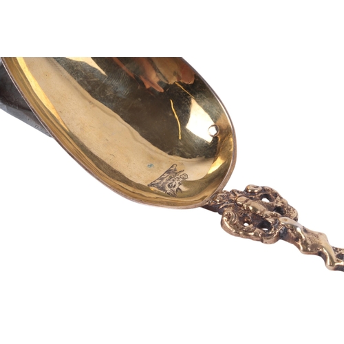 695 - A Victorian silver spoon with pierced bowl, twisted shaft and figural terminal, Sheffield 1875; toge... 