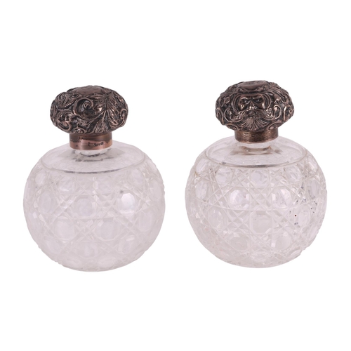 700 - A large pair of late Victorian silver topped hobnail cut glass scent bottles of globular form, Chest... 