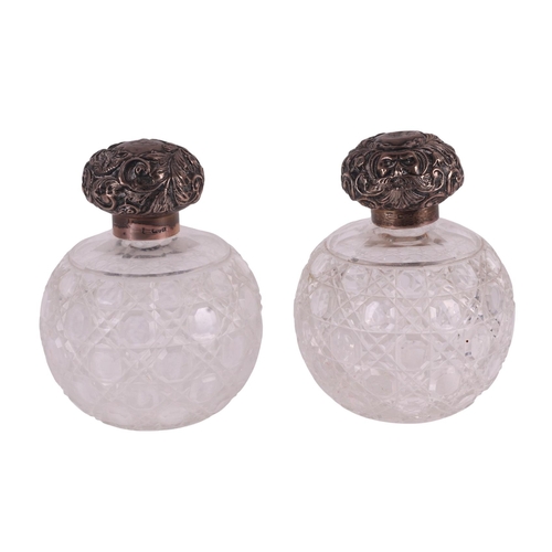 700 - A large pair of late Victorian silver topped hobnail cut glass scent bottles of globular form, Chest... 