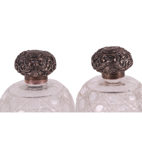 700 - A large pair of late Victorian silver topped hobnail cut glass scent bottles of globular form, Chest... 