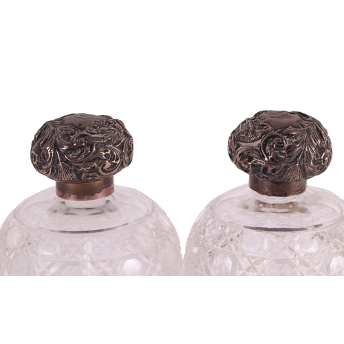 700 - A large pair of late Victorian silver topped hobnail cut glass scent bottles of globular form, Chest... 