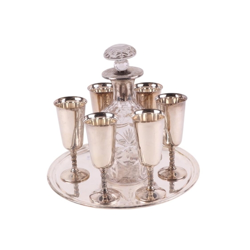 708 - A set of six silver plated goblets on a silver plated tray with cut glass white metal mounted decant... 