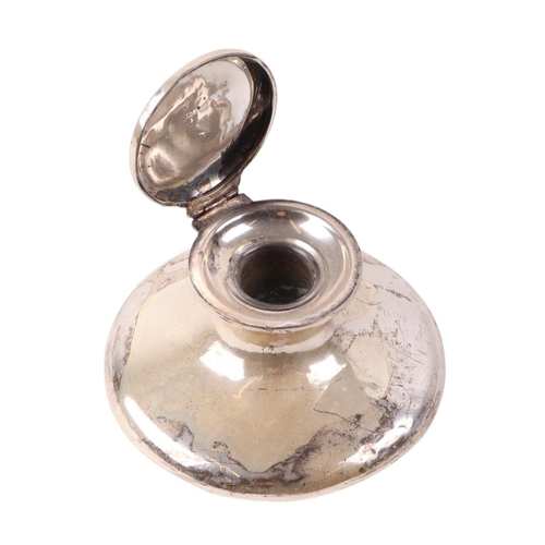 740 - A silver Capstan inkwell, Chester 1912, 12.5cms wide, 331g gross weight.