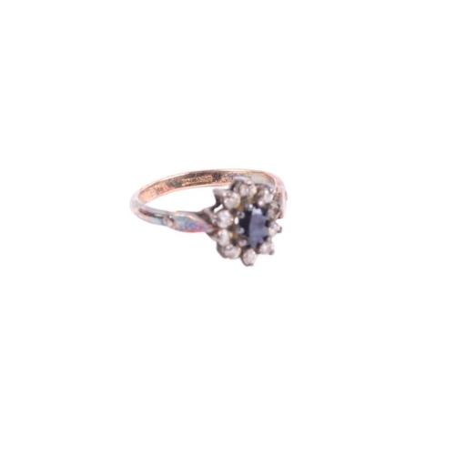 765 - A gold and silver dress ring.